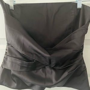 BCBGMaxazria black strapless top with fully zippered back. Size M.
